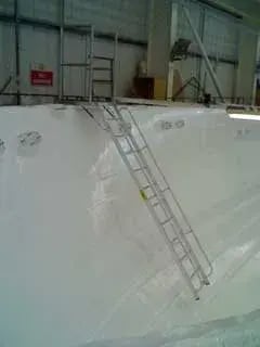 Platform-with-gas-spring-hinged-ladder