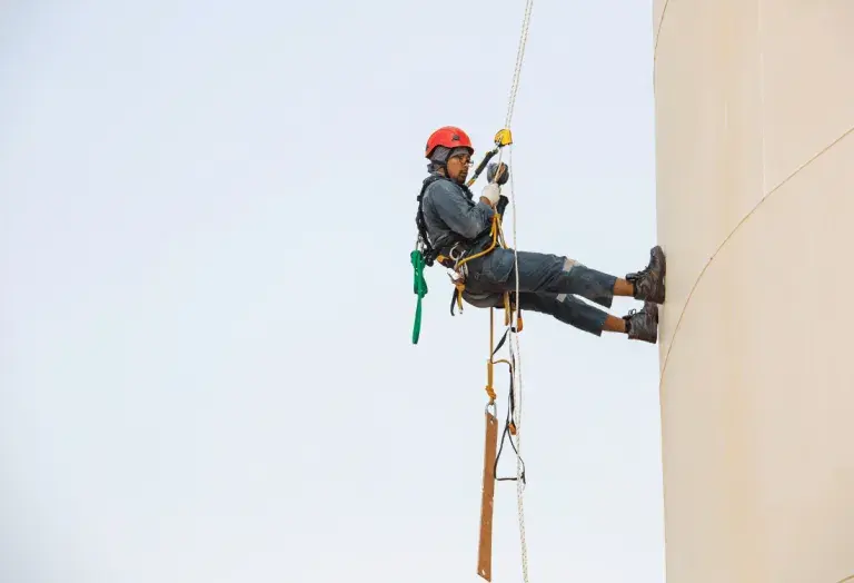 A man using work-at-height equipment that has been checked and is considered safe to use.