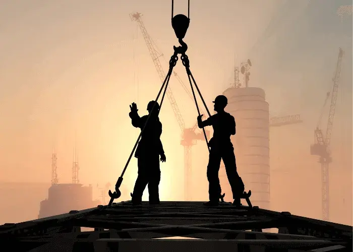 2 construction workers working at height