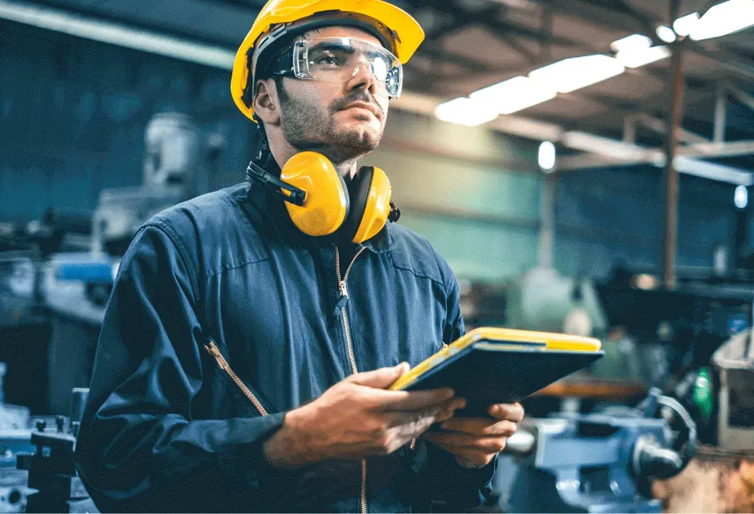 A worker using technology to prevent accidents from happening in the workplace.