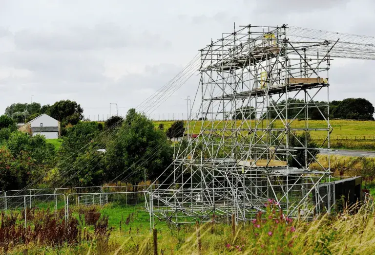 A scaffold tower is currently not in use due to unsafe ground conditions.